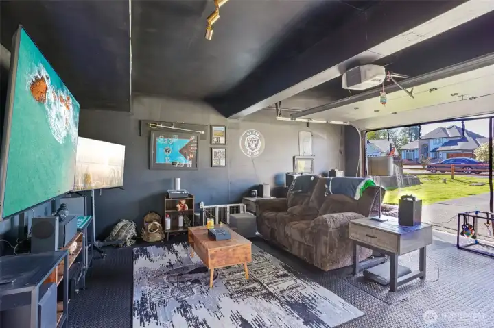 2-car garage currently styled as a bonus hangout space, perfect for hobbies, game day, or extra storage.