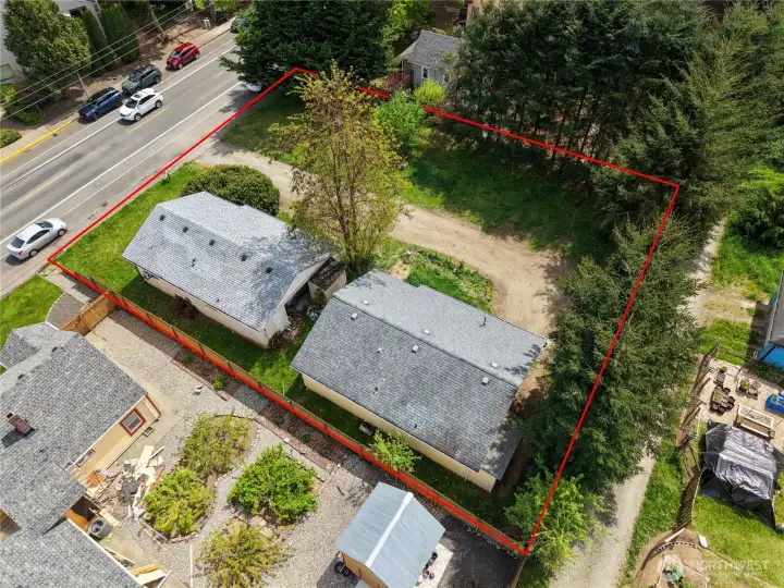 Two properties and an additional lot just minutes from downtown! Wow! Each home is 2 bedroom, 1 bathroom plus a carport. Great investment! There is an alley (right side of the picture) where is appears you could access 523--buyer to verify.