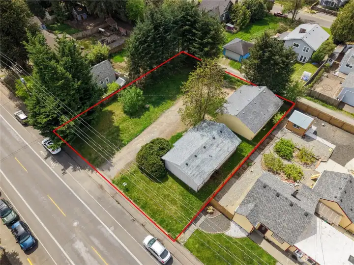 Each home has 2 bedrooms, 1 bathroom plus a carport. Great investment! There is an alley (right side of the picture) where is appears you could access 523--buyer to verify.