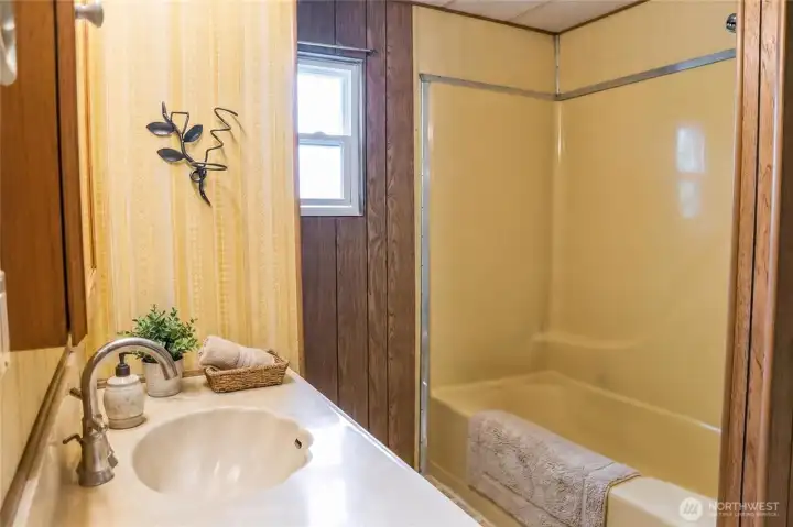 Secondary Bathroom.  Tub & shower.