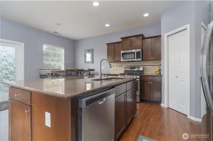 Stainless steel appliances and granite counter
