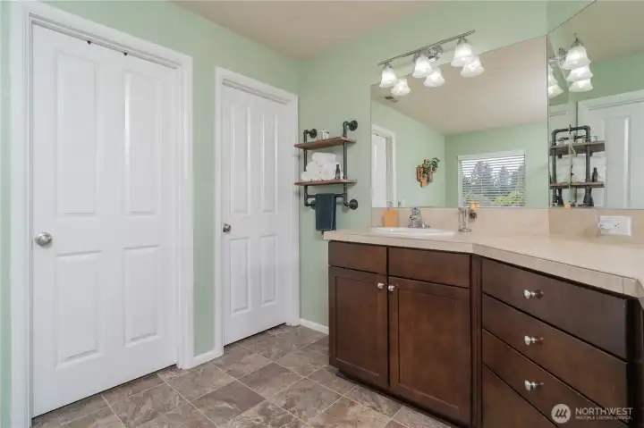 Another view of Primary Bathroom with walk in closet and private toilet room