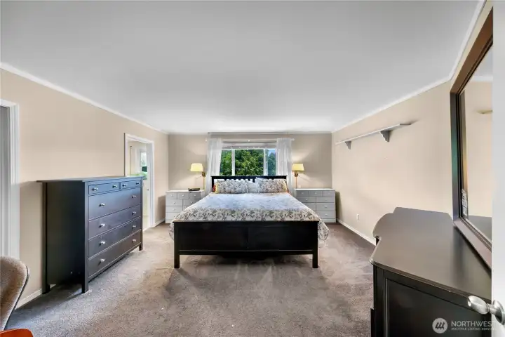 Expansive primary bedroom with en suite