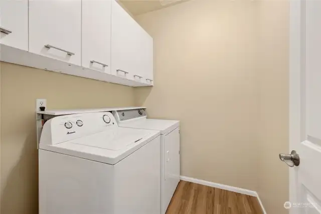 Laundry room with extra storage built in.  Washer and dryer included.