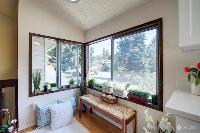 Sunny and bright, this kitchen eating nook is like a sunroom