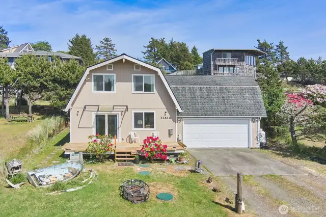 Classic barn-style roof gives this beachside retreat unique character and charm
