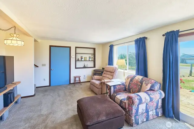 Living room has a corner propane fireplace to keep things toasty during the winter months.