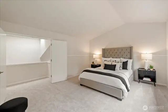 Primary suite with vaulted ceilings