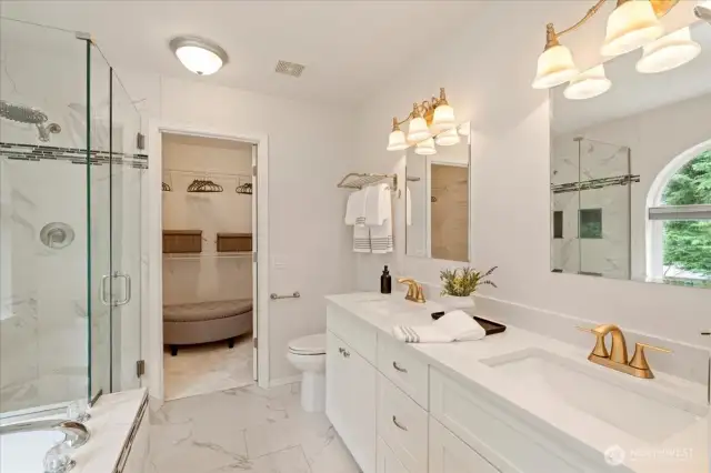 Updated primary bathroom with new vanity and quartz counters