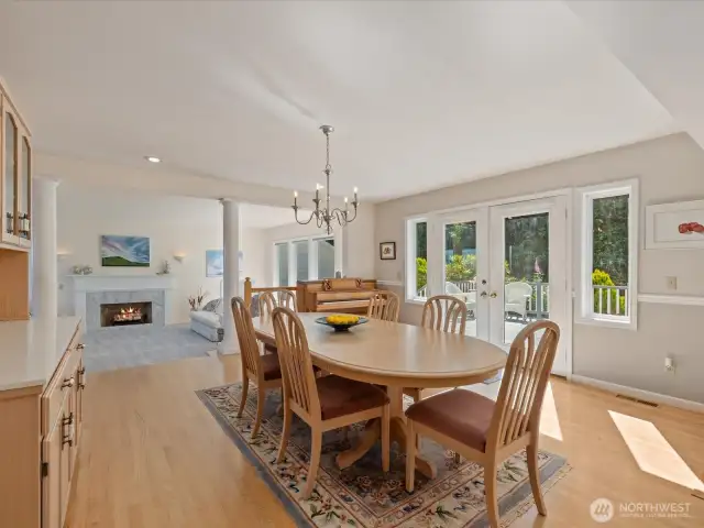 Dining connects to the Kitchen & Living Room with French doors out to the large Deck.
