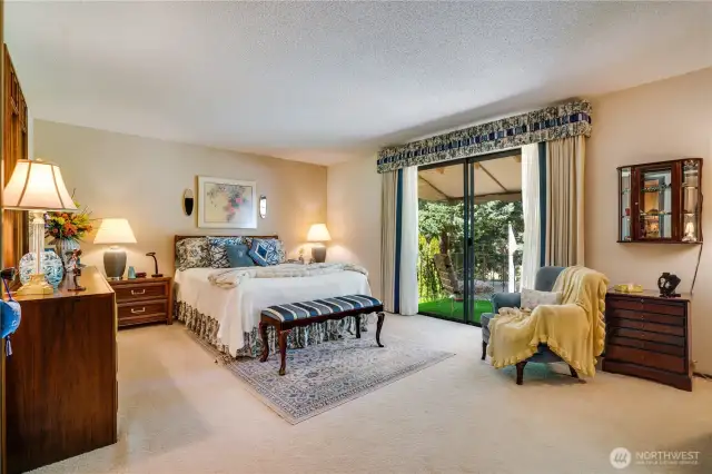 Primary suite with private covered balcony, en-suite bathroom and walk-in closet.