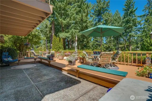 This outdoor entertainer’s paradise boasts an expansive space with versatile seating options, featuring a sprawling deck and patio.