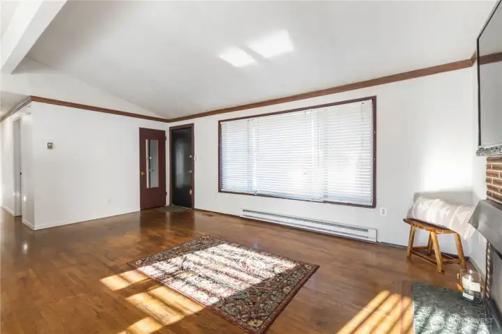 This angle views the Living Room from the Dining Room. Notice the large picture window. Lots of natural light.