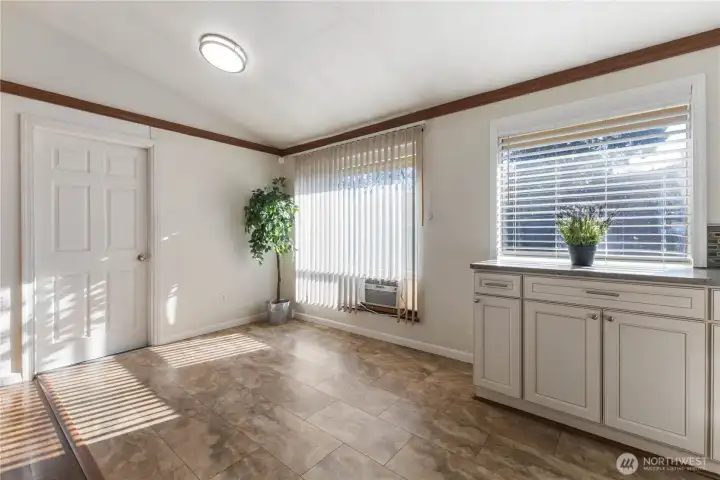 Dining Room area with no shortage of windows.