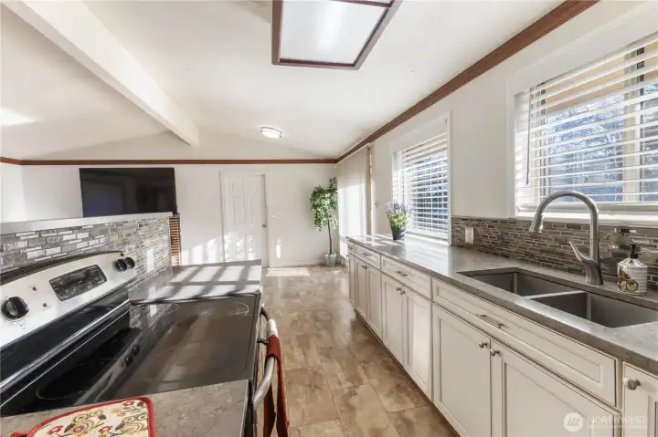 Looking through the Kitchen to the Dining Room, with the Garage Door beyond.