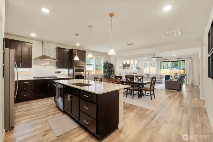 Gourmet kitchen with large center island and ample cabinets