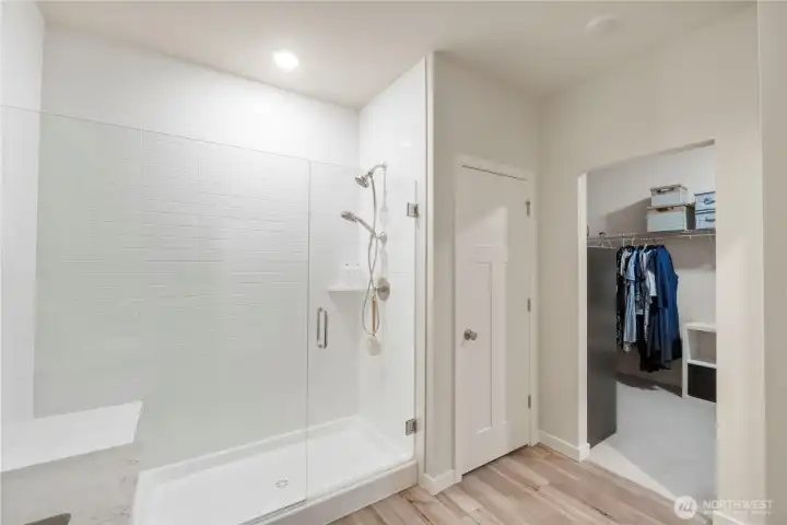 Spa-inspired bathroom with dual sinks and walk-in shower