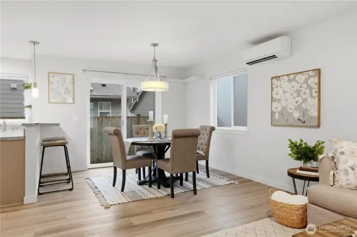 Bright cheery dining space with access to back patio and yard.