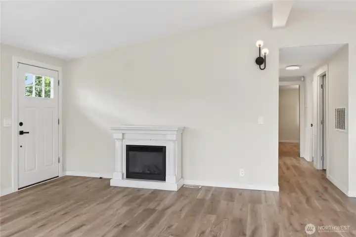 Living Room with Electric Fireplace and Front Entry