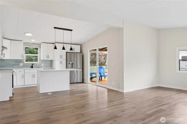 Open-Concept Kitchen and Living Area with Slider to Deck