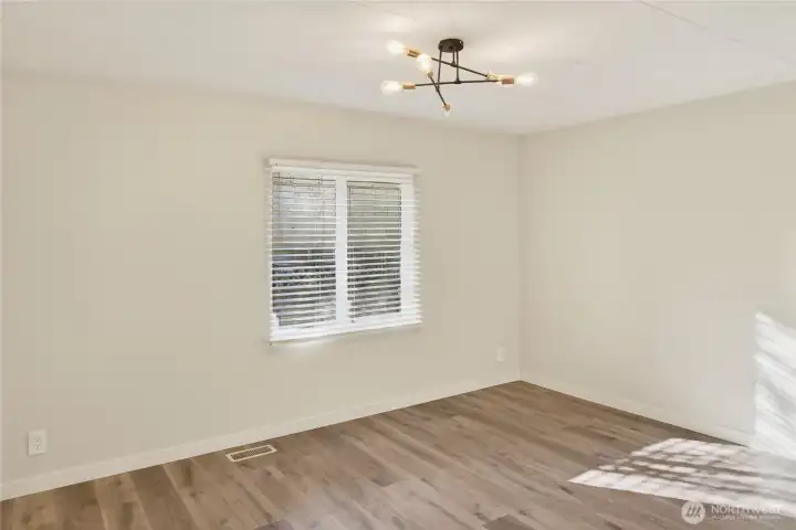 Primary Bedroom with Sputnik Light Fixture and Natural Light