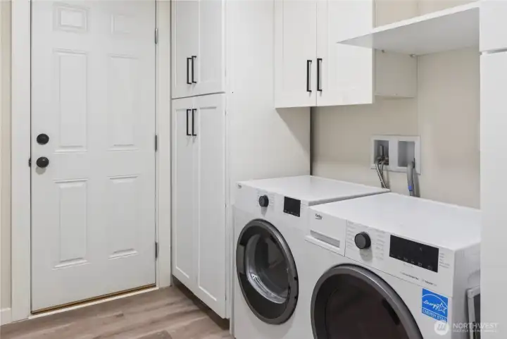 Laundry Room with Full-Size Washer & Dryer, Upper Cabinets, and Exterior Door