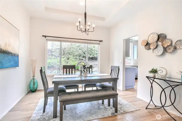 Oversized window in dining room engulfed w/ natural light