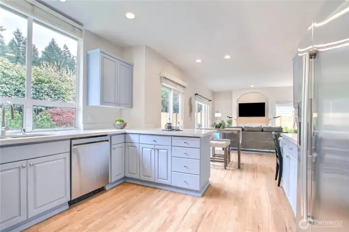 Look at all those windows facing your private backyard- A Chef's dream and amazing place to cook meals!