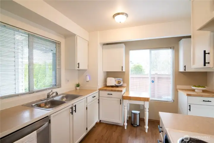 Professionally painted cabinets, black hardware & additional cabinets for more storage.