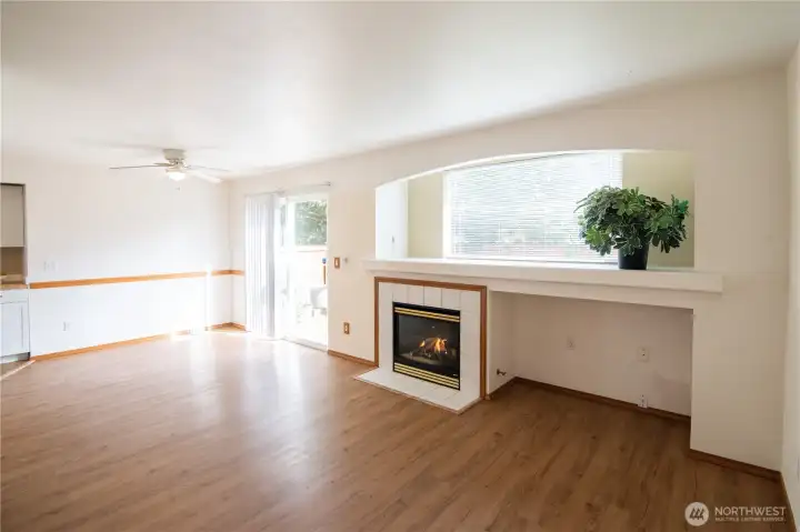Welcoming living room with gas fireplace and built in tv nook.