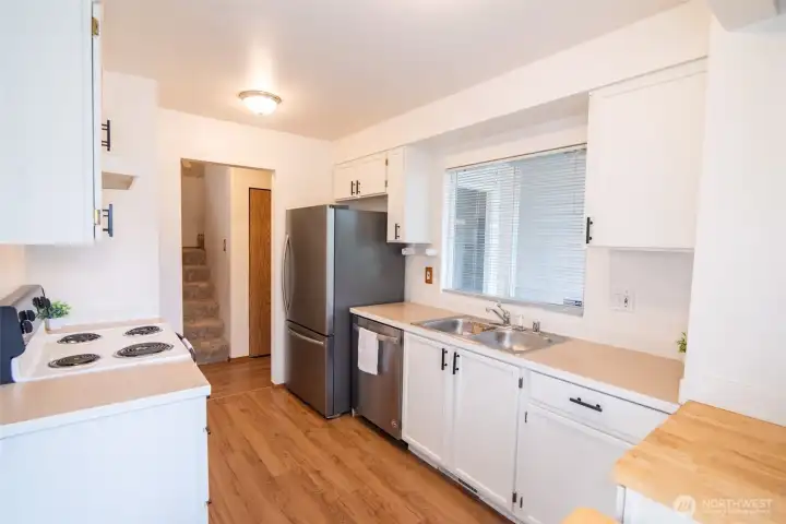 Light, bright kitchen with newer stainless fridge & dishwasher. Light, bright kitchen with newer stainless fridge & dishwasher.