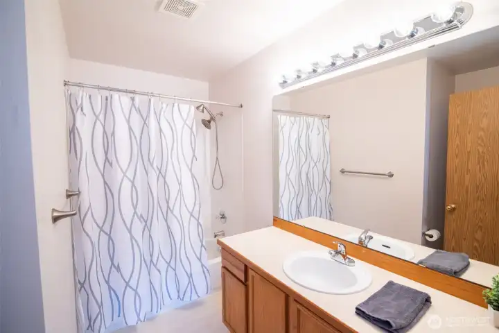 Primary bathroom with a full tub & shower. Primary bathroom with a full tub & shower.
