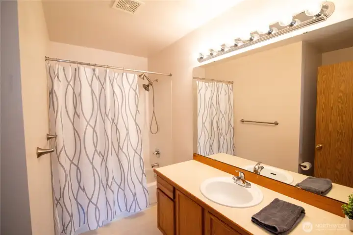Primary bathroom with a full tub & shower.