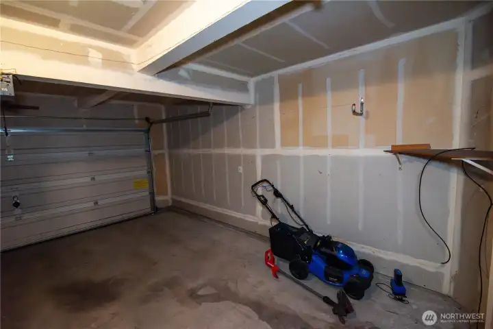 2 car garage, electric lawnmower conveys!