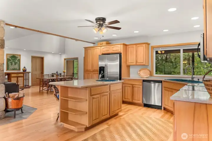 Excellent floor plan flows from Kitchen to gorgeous dining room area. Friend and family will love the views served with dinner every day! Additional freestanding woodstove in Dining room area.