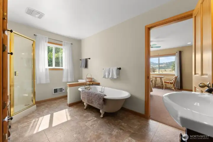 Upper level guest bath is off of 2nd bedroom. Next to Loft Small office library den area. Easy care. Soaking clawfoot tub, Pedestal sink and shower.