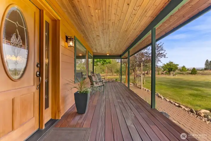 Front door has Covered entry and Brazilian Ironwood decks around home.