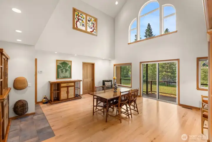 Dining room has tremendous views and natural light. Glass doors open to Ironwood deck and outdoor riverside setting and lounge area.