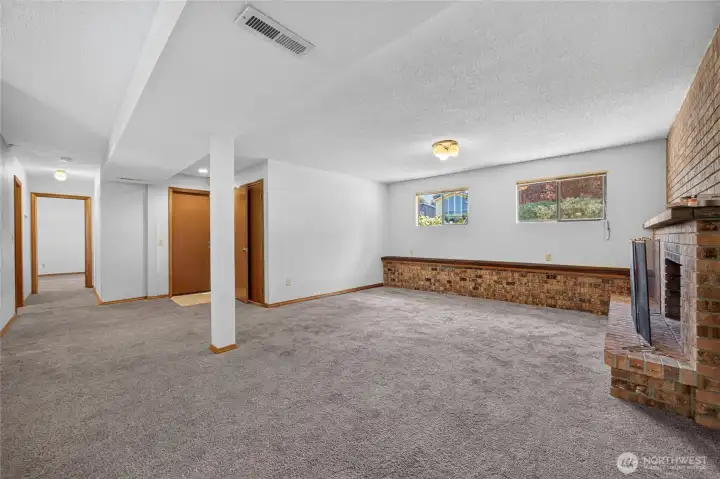 Downstairs of the split level Family room, sliding glass door to back yard, 4th bedroom and 3/4 bathroom.