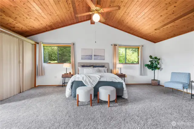 Expansive primary bedroom with private deck