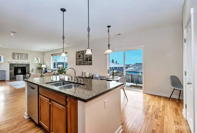 Open-concept kitchen to family room. Sliding door to backyard.