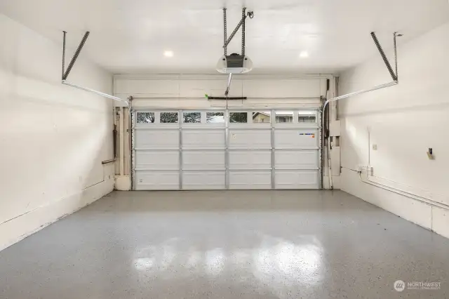 The two car garage has new garage door, Fully painted, and EProxy floor.