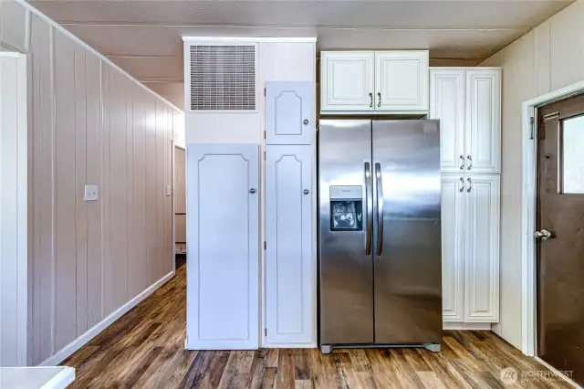Stainless fridge and large pantry.