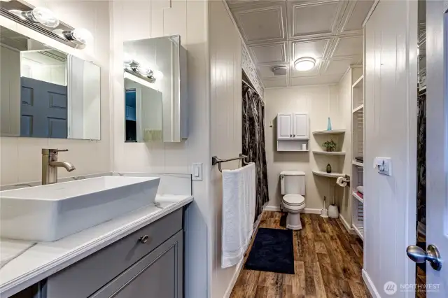 The updated primary bath with plenty of storage space.