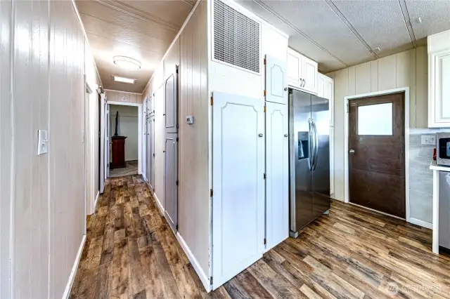 The side door and the hallway to the bedrooms.