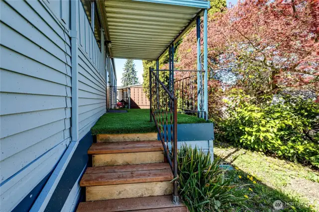 Stairs from the back deck leading to the yard.