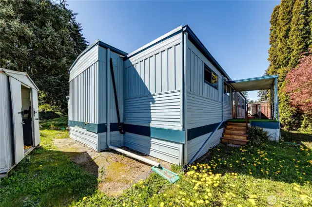 The backyard and one of the two sheds.