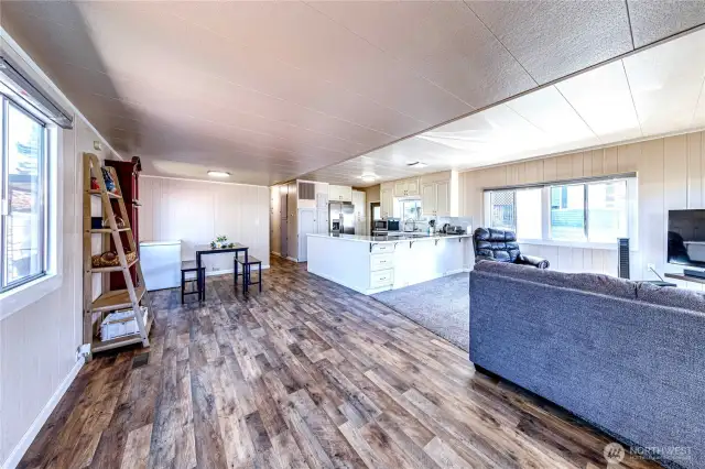 The open living, dining and kitchen area.