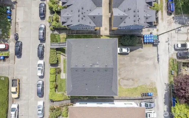 Street-to-alley lot with 2-car garage and 6-8 tandem-style parking spaces.
