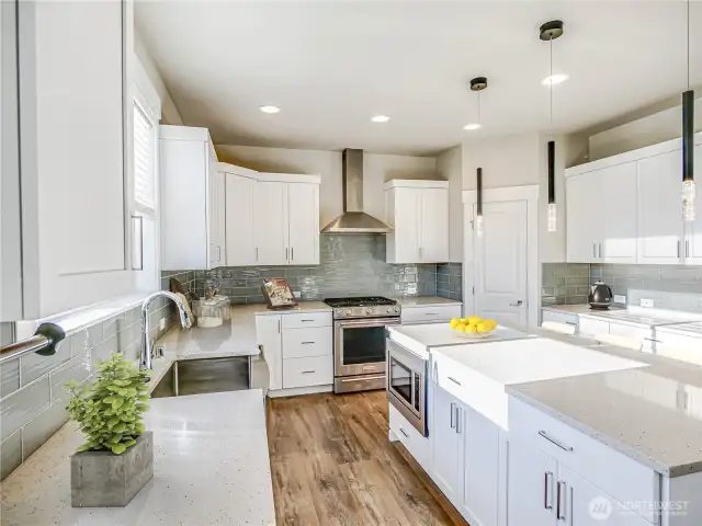 A kitchen to be envied for its generous storage. Beautiful quality cabinetry with soft close cabinets.  Dont Miss walk in pantry.